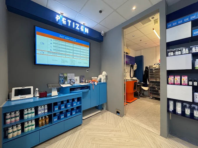 Inside Petizen: the service counter, pet care shelves and the grooming room behind
